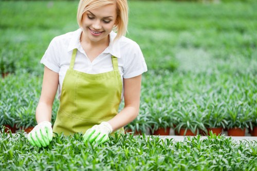 Gardeners separating green waste and recyclable materials